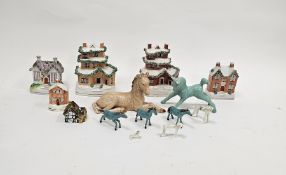 Five late 19th century Staffordshire pottery house money boxes, appplied with extruded clay, one