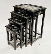 Chinese ebonised nest of four tables, each with a relief mother-of-pearl and painted scene of
