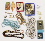 Collection of costume jewellery including beads, simulated jet jewellery, cufflinks, bracelets,
