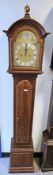 Mid-century mahogany and banded cased eight-day grandmother clock in the Georgian manner, the broken
