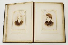 Victorian brown leather family portrait album, partially filled containing approximately forty-six