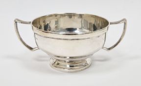 Silver twin-handled bowl, Birmingham 1947, Bishton's Ltd, of plain form with shaped handles, on a