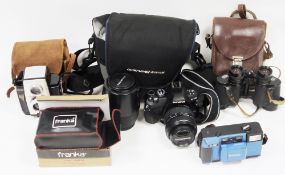 Collection of three cameras including Olympus E-410 camera with lens in soft case, Kodak Brownie