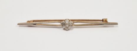 Unmarked yellow gold, platinum and diamond bar brooch, set with flower shaped cluster of six