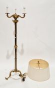 Late 19th/early 20th century brass standard lamp having three foliate scroll cast branches, on a