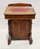 Victorian walnut davenport, the sloping lid with a red leather inset writing surface, opening to a