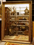 Large 20th century rectangular mirror, the gilt frame with beaded and reeded border and a moulded