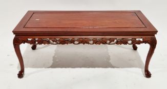 Chinese hardwood coffee table, the rectangular top over a pierced carved frieze in the form of