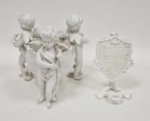 English porcelain white glazed figural vase, late 19th century, modelled as three winged putti