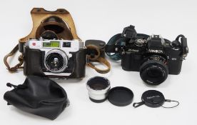 Minolta X700 camera, a macro lens and a Petri camera in case