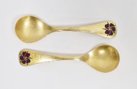 Pair of Georg Jensen sterling silver gilt 1974 Year Spoons, each with enamel decoration of a corn