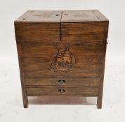 South East Asian hardwood sewing/work cabinet, the two hinged lids with carved decoration opening to