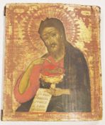 19th century Russian Orthodox icon depicting St. John the Baptist, painted on a curved panel with