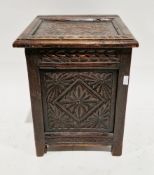 Victorian oak coal/log box in the 17th century manner, the carved hinged lid with moulded edge, over