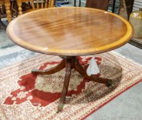 Arthur Brett of Norwich mahogany and satinwood crossbanded oval extending dining room table, the