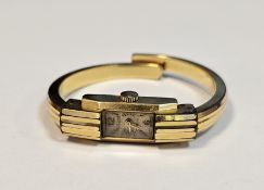 Lady's Allaine rolled gold wristwatch in Art Deco style and having sprung bangle