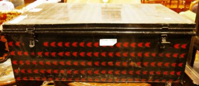 Large early 20th century black metal trunk having a red pattern design, two handles and two keys,