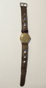 Gent's 9ct gold Swiss strap watch (maker's name faded on dial), the circular dial with gilt numerals