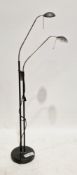 Contemporary Italian two-branch reading floor lamp, each branch with adjustable goose neck, on a