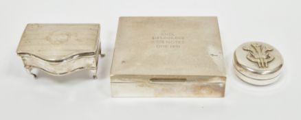 Three silver boxes including a trinket box, Birmingham 1918 of serpentine form, on four cabriole