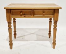 Modern pine side table having two moulded edge frieze drawers with turned pine knob handles, on