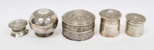 Five Anglo-Indian white metal betel boxes, two with chased foliate scrolling decoration and