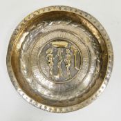 Nuremberg brass alms dish, late 16th/early 17th century, decorated in repousse with Adam and Eve