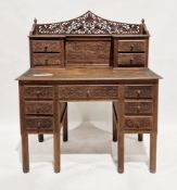 Late 19th/early 20th century Anglo-Indian hardwood desk with profuse pierced and scrolling foliate