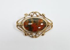 9ct yellow gold swivel brooch, comprising an oval panel set with mother or pearl and moss agate,