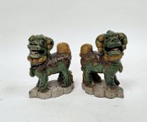 Pair of Chinese Sancai glazed small models of Buddhist lions, Kangxi, each modelled standing
