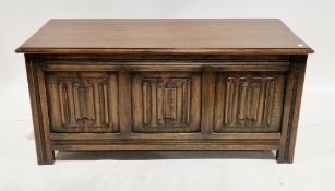 Oak coffer in the 17th century manner, the hinged top with thumbmould edge, three front panels
