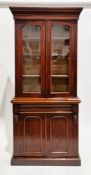 Victorian mahogany library bookcase, the moulded pediment over two glazed doors opening to three