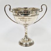 Edward VII silver twin-handled trophy, London 1910, maker's mark rubbed, of plain form with ribbed