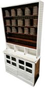 Victorian pine shop fitting cabinet, mostly painted white, the upper section with moulded cornice