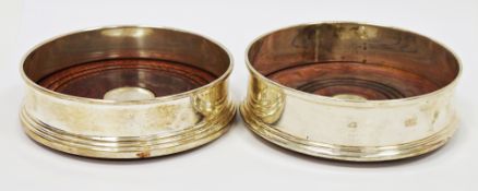 Silver and turned oak wine coaster, Birmingham 2003, W I Broadway & Co, of circular form with