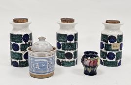 Set of three Portmeirion pottery Talisman pattern cylindrical storage jars and cork stoppers,