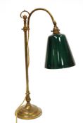 Edwardian style gilt-brass desk lamp with loop carrying handle, swan neck and green glass shade,