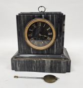 An early 20th century French eight-day mantel clock in a substantial grey veined marble case of