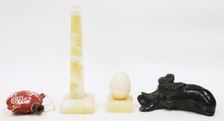 Canadian Wharf Sculptures inuit carving of a man riding a whale, 21cm long, a carved onyx obelisk on
