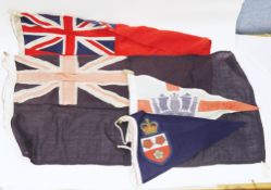 Collection of flags and bunting including two Royal Naval ensign flags, largest 91cm long, five