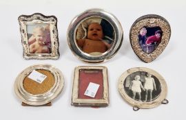Collection of six small silver framed easel back photograph frames including a heart-shaped frame