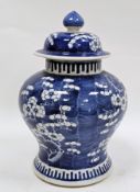 Chinese porcelain blue and white prunus pattern baluster vase and cover, four-character Kangxi