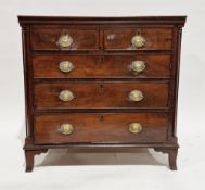 George III walnut and oak chest, having two short and three long cockbeaded graduated drawers, brass