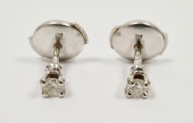 Pair diamond stud earrings, white metal set, in case  Condition Report Total weight - 1.4 grams