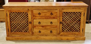 John Lewis 'Maharani' hardwood sideboard comprising three short drawers flanked by pierced
