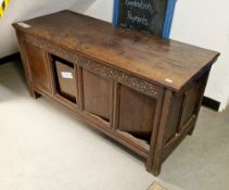 18th century oak coffer, having a hinged lid over a four panel fronted, the panels converted to