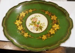 Green lacquered papiermache oval tray, with moulded shaped edge and decorated with a central