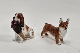 Royal Doulton bone china model of a cocker spaniel carrying a pheasant in its mouth, 13.5 cm high