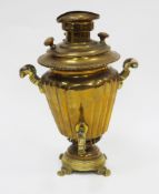 19th century brass samovar, the fluted tapered body with twin wooden turned handles, on a stepped