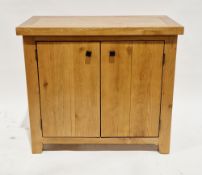 Contemporary oak side cabinet, the rectangular top over two panel doors with square metal handles,